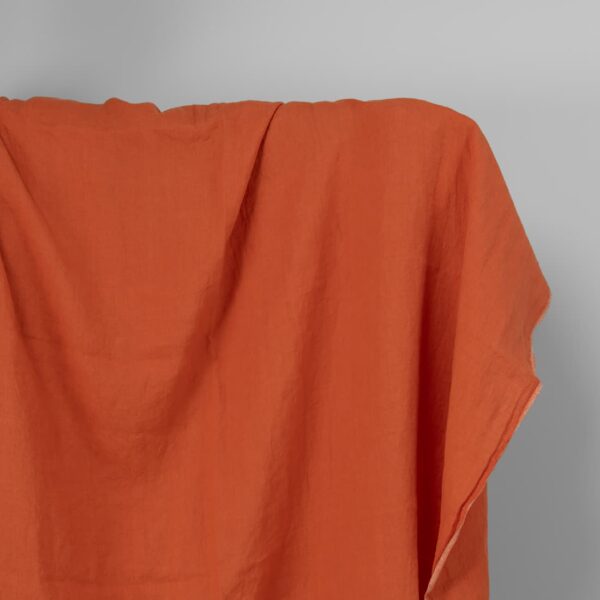 Washed linen fabric in dark orange