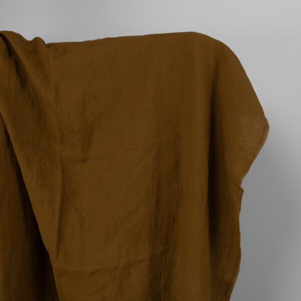 Washed linen fabric in golden brown