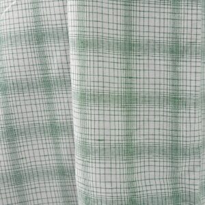 White linen cotton fabric with striped green checks close view photo
