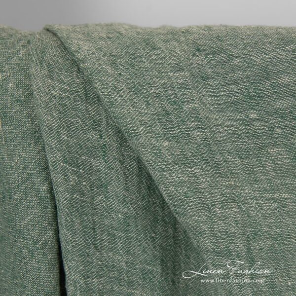Transparent linen fabric in green colour.