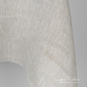 Läpikuultava vaaleanharmaa pellavakangas