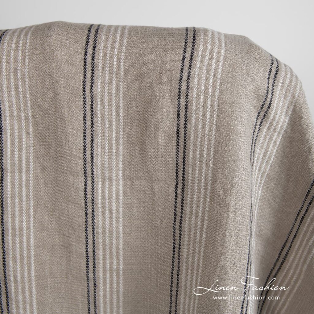 Harmaanruskea pellavakangas raidoilla pesty 2 Grey brown linen fabric in stripes, specially washed to increase softness