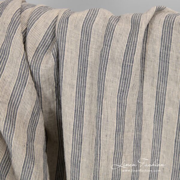 Washed cream colour linen fabric with stripes.