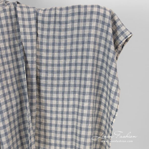 Cream colour linen fabric in blue checks.