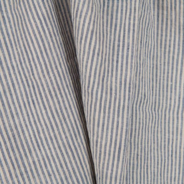 Washed linen fabric with brownish and blueish grey stripes close up view
