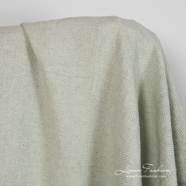 Linen green fabric herringbone pattern