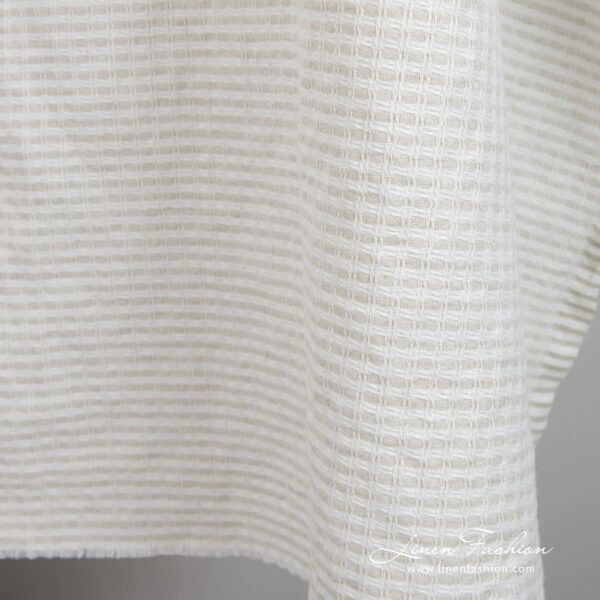 Light grey linen cotton fabric in checks, specially washed to increase softness