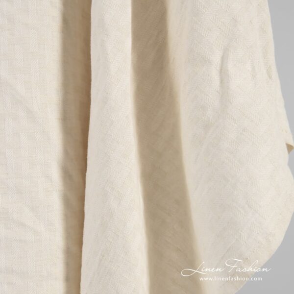 Linen cotton fabric in patterned stripes that forms checks