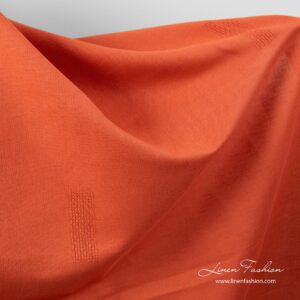 Liekinpunainen pellavapuuvillakangas reikäommelkuvioilla