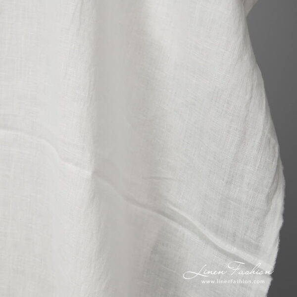 Lightweight washed linen fabric white colour close up view