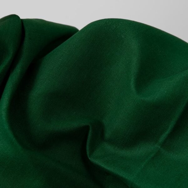 Emerald green linen cotton fabric close up detail