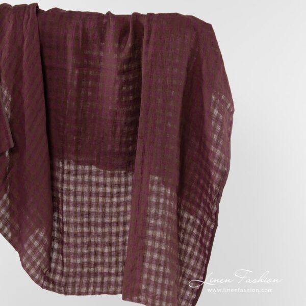 Linen fabric in brown and purple checks.