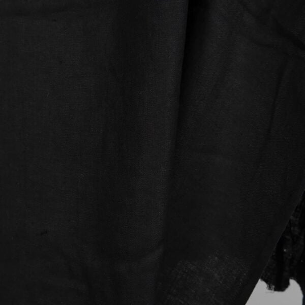 Black washed linen fabric in herringbone close up detail