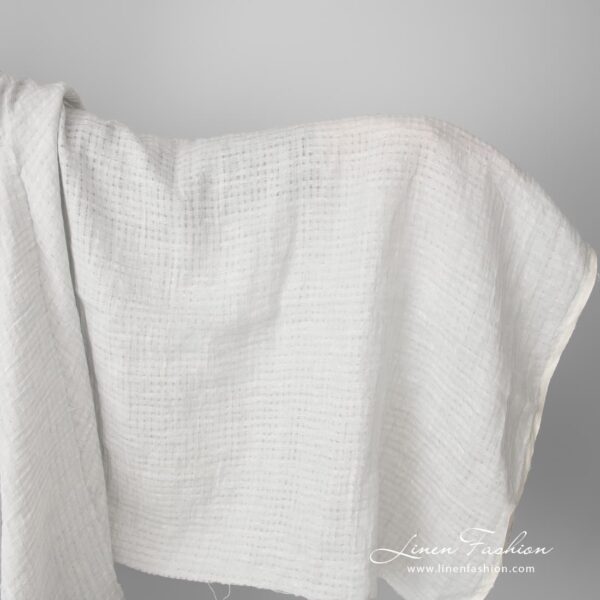 Light grey openwork linen fabric, washed