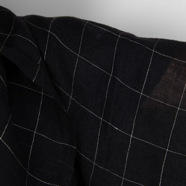 Black transparent checked linen fabric washed close up detail