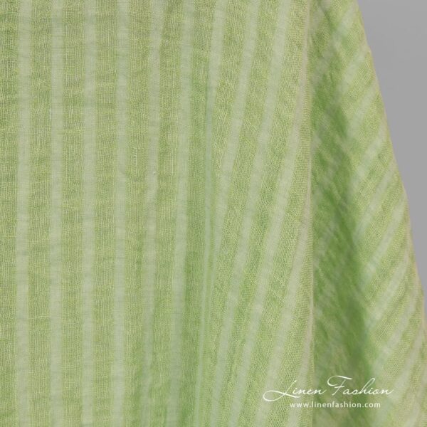 Washed 100% linen fabric in lime green stripes.