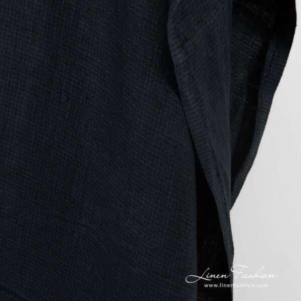 Dark blue linen fabric in twill weave and barely visible checks, specially washed