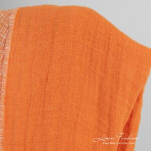 Kaksipuolinen oranssi pellavakangas ruuduilla, pesty