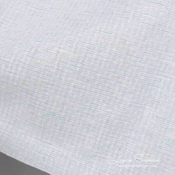 Linen cotton fabric blueish white pattern close up detail