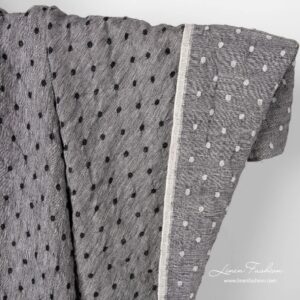 Musta/valkoinen pellava-villakangas pilkuilla pesty 7 Black white linen wool fabric with dots.