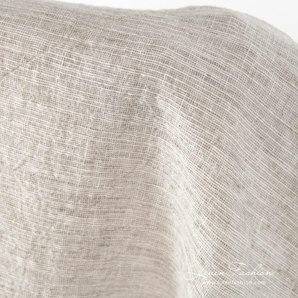 Leveä ruskeanharmaa pesty pellavapuuvillakangas 3 Grey-brownish wide linen-cotton fabric.
