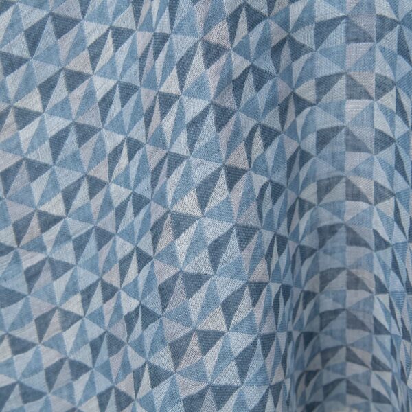 Washed linen fabric in blue triangles close up detail