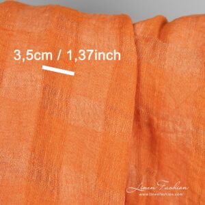 Oranssi pesty pellavakangas, läpikuultava ruutukuvio