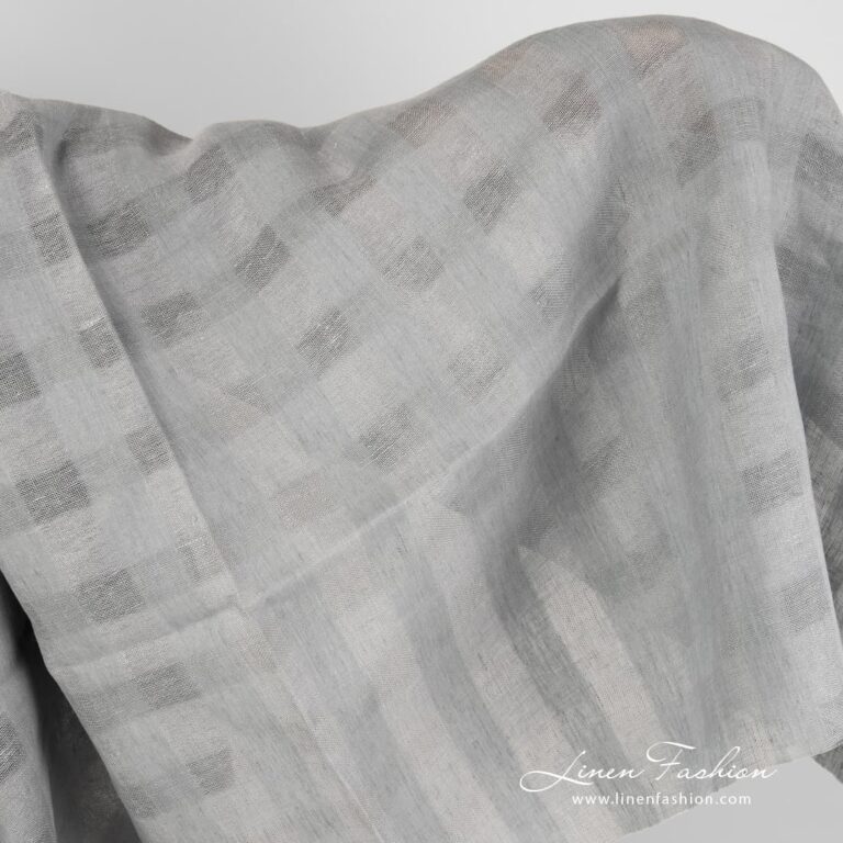 Grey linen fabric with sheer checks.