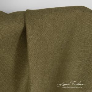 Moss green dyed linen fabric in diagonal pattern.