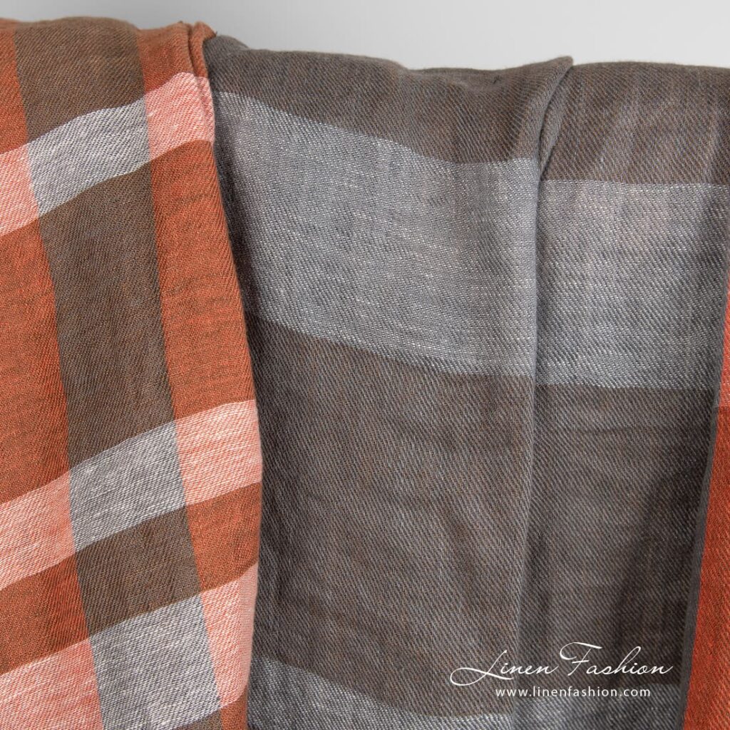 Pellavakangas oransseilla ja ruskeilla raidoilla pesty 2 Linen fabric in orange and brown stripes, specially washed