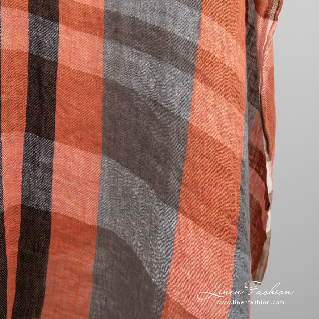 Pellavakangas oransseilla ja ruskeilla raidoilla pesty 4 Linen fabric in orange and brown stripes, perfect for clothes, accessories and home textile