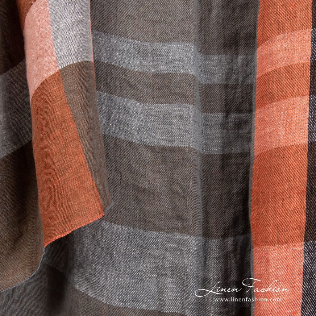 Pellavakangas oransseilla ja ruskeilla raidoilla pesty 3 Linen fabric in orange, brown stripes