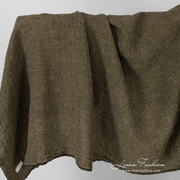 Linen fabric in moss green, washed.