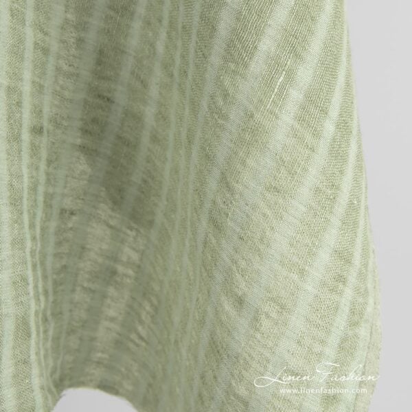 Green linen fabric in transparent vertical stripes