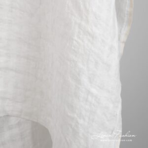 Luonnonvalkoinen pellavakangas läpikuultavin ruuduin pesty