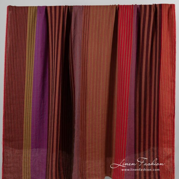 Linen fabric in vertical stripes, woven from black, brown, green and violet yarns