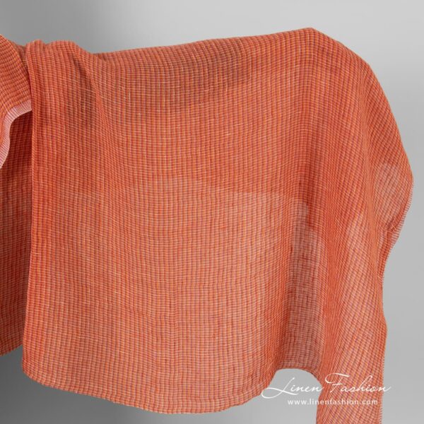 Transparent linen fabric in orange melange, washed