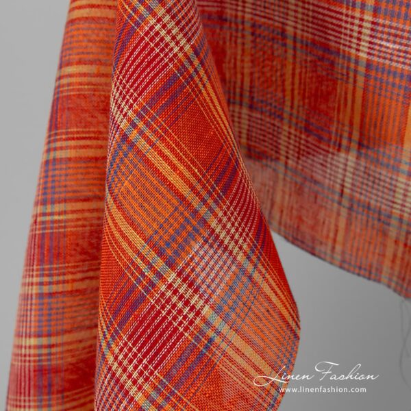 Transparent 100% linen fabric in red orange checks.