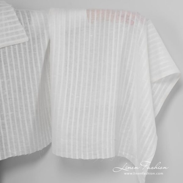 Off white linen fabric with open weave stripes.