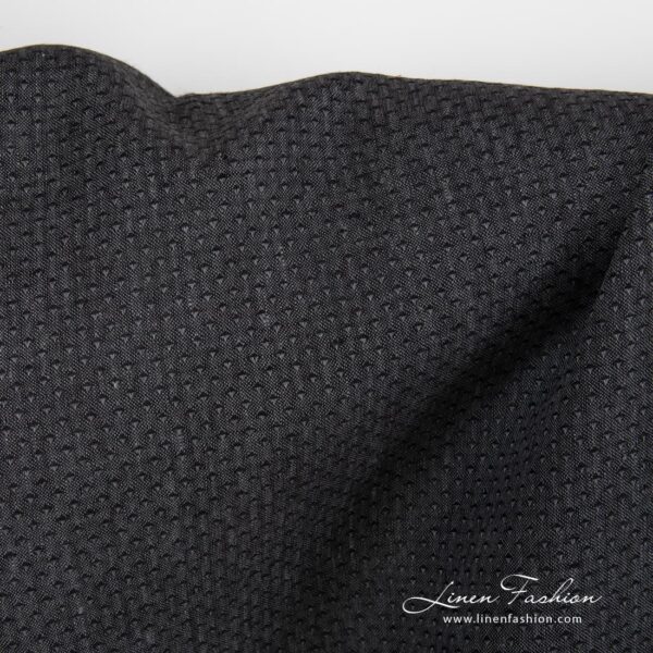 Black 100% linen fabric, patterned.
